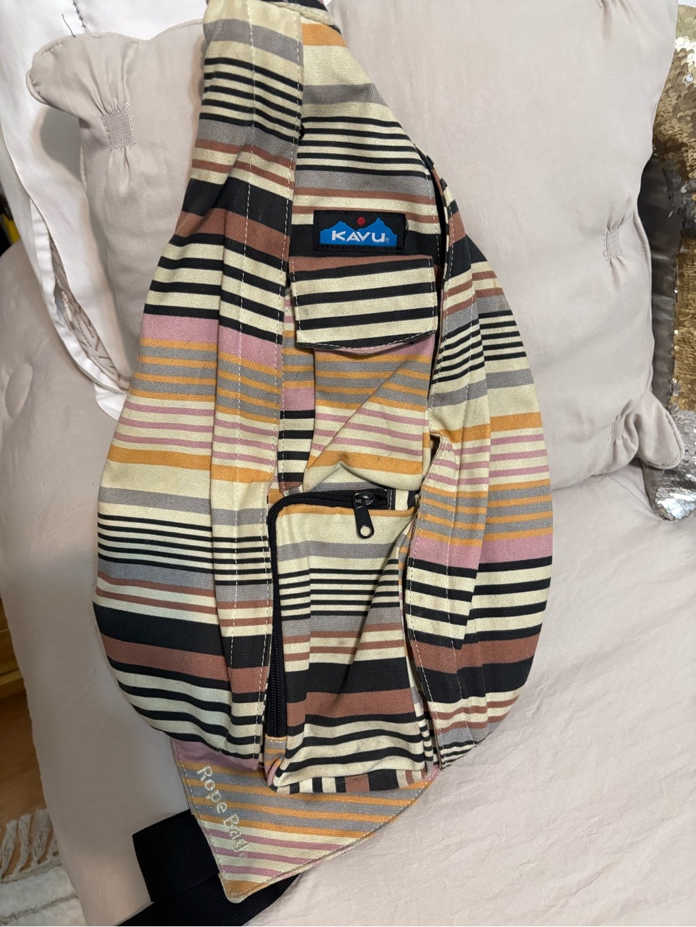Kavu Striped Rope Sling Bag in Black, Cream, Pink & Tan